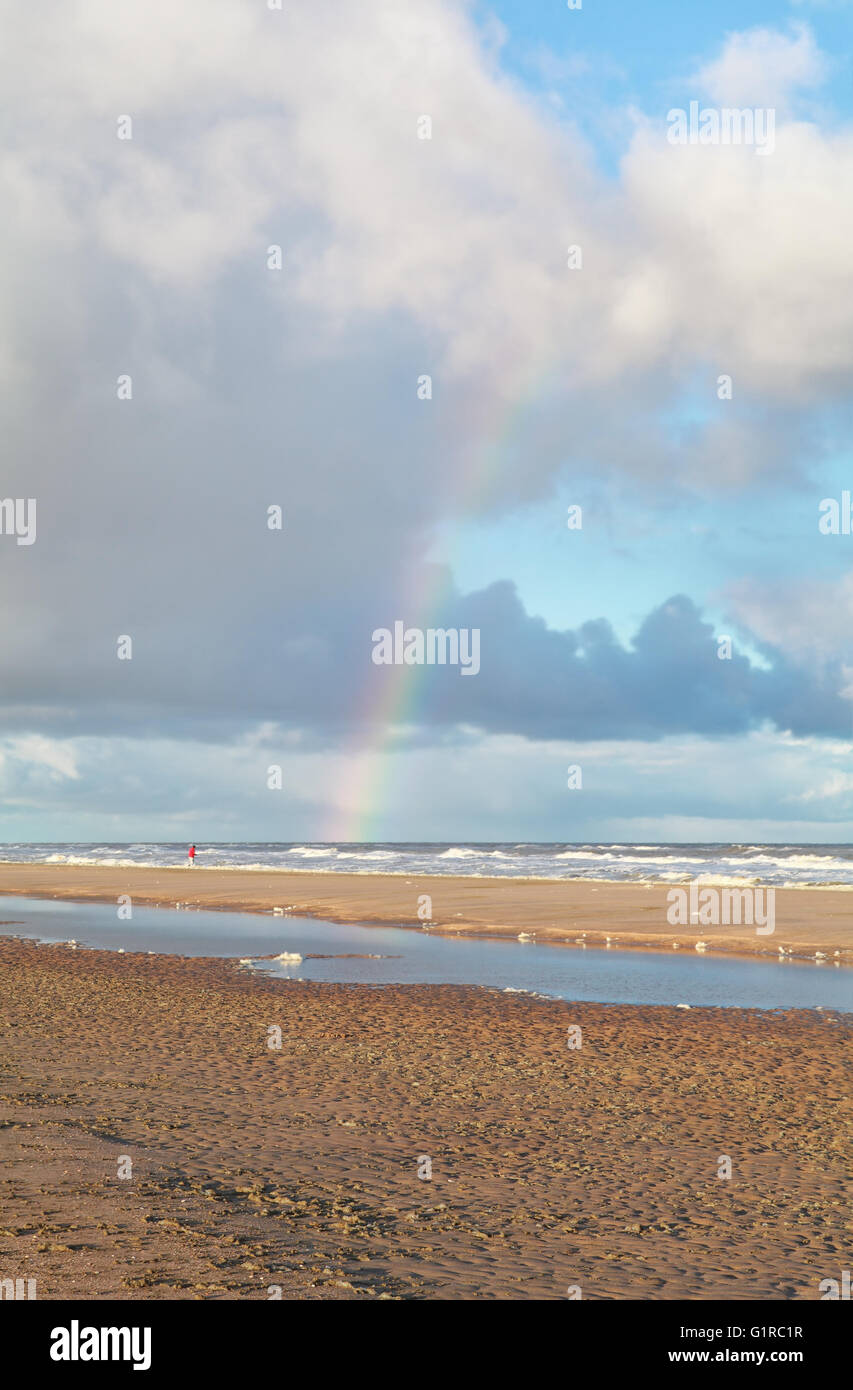 rainbow over north sea beach, North Holland, Netherlands Stock Photo