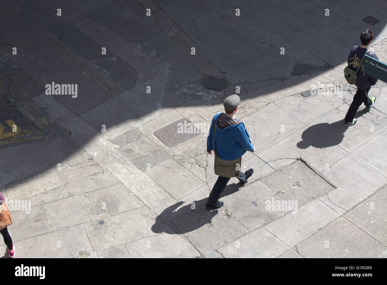 Young man  with shadow viewed from above,Glasgow, Scotland, UK Stock Photo