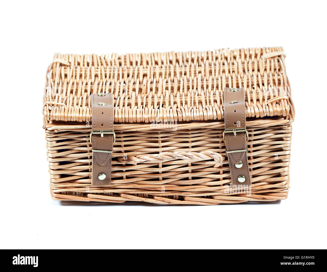 wicker basket with straps on isolated white background Stock Photo