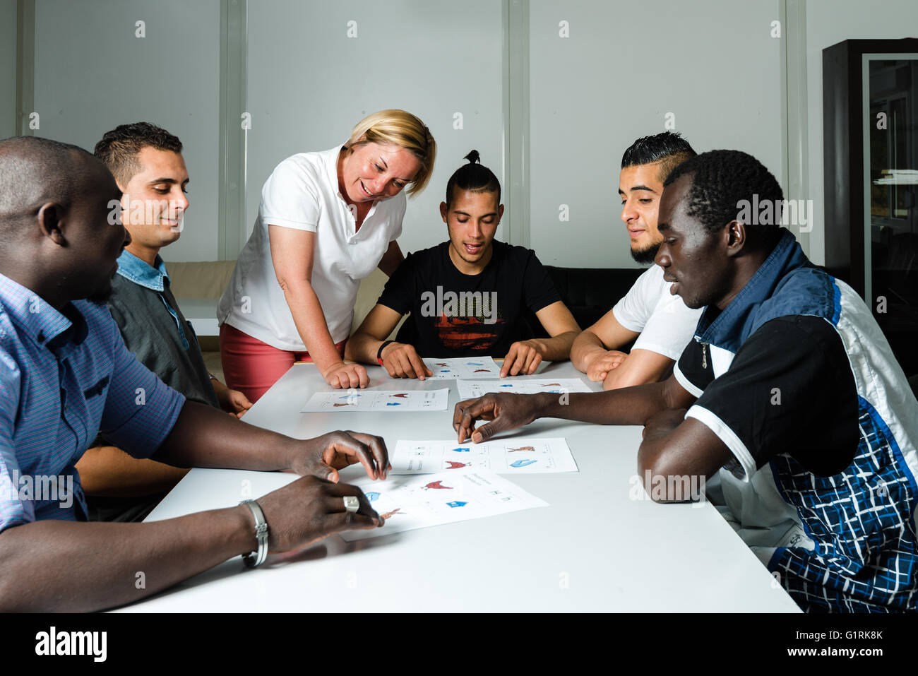 Language training for refugees in a German camp Stock Photo