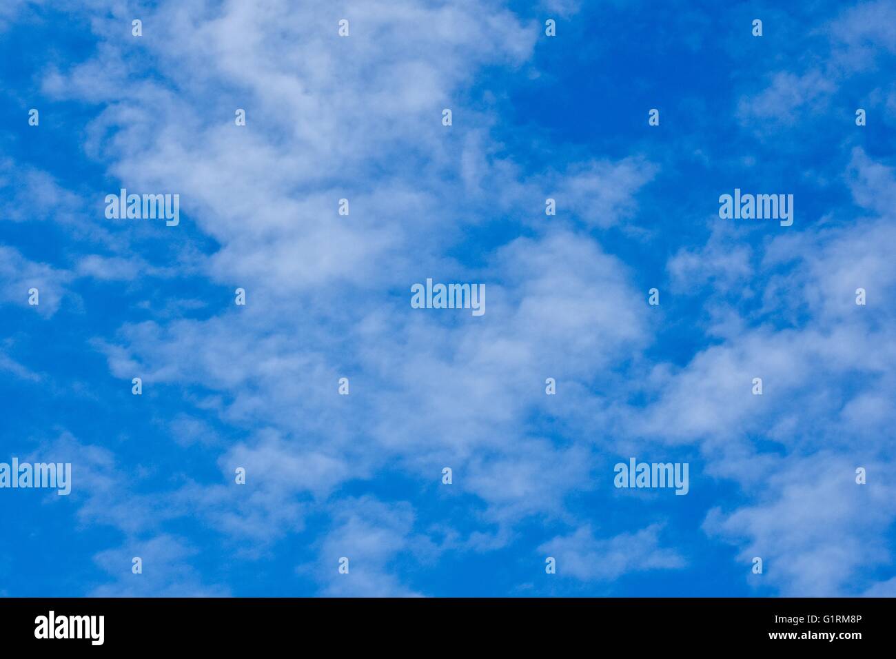 A blue sky day with soft white clouds Stock Photo - Alamy