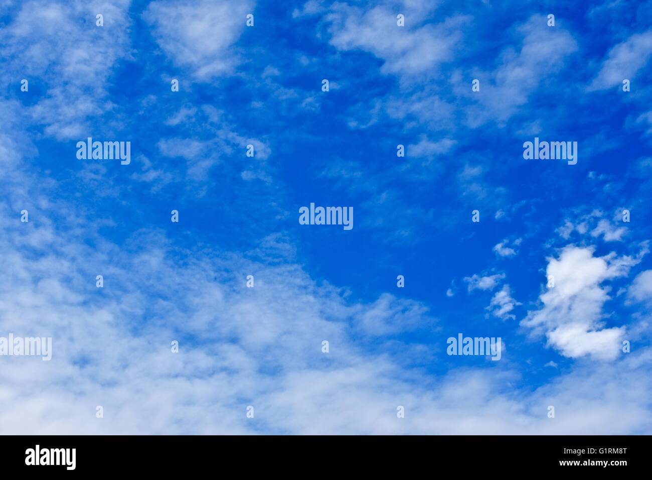 A blue sky day with soft white clouds Stock Photo - Alamy