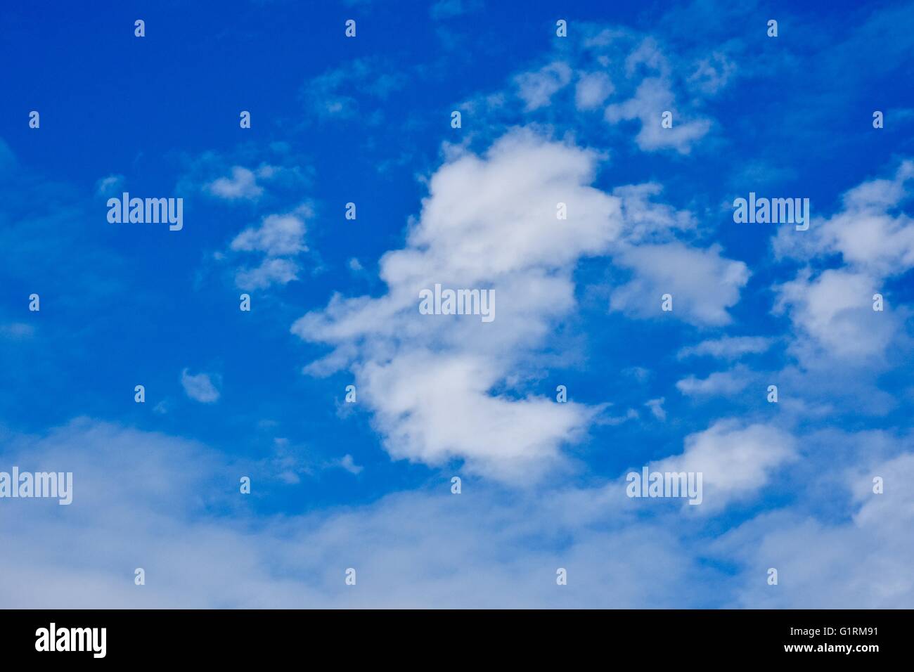 A blue sky day with soft white clouds Stock Photo - Alamy