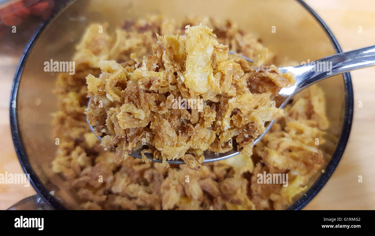 Dry onion flakes, in front of more brown onion flakes Stock Photo Alamy