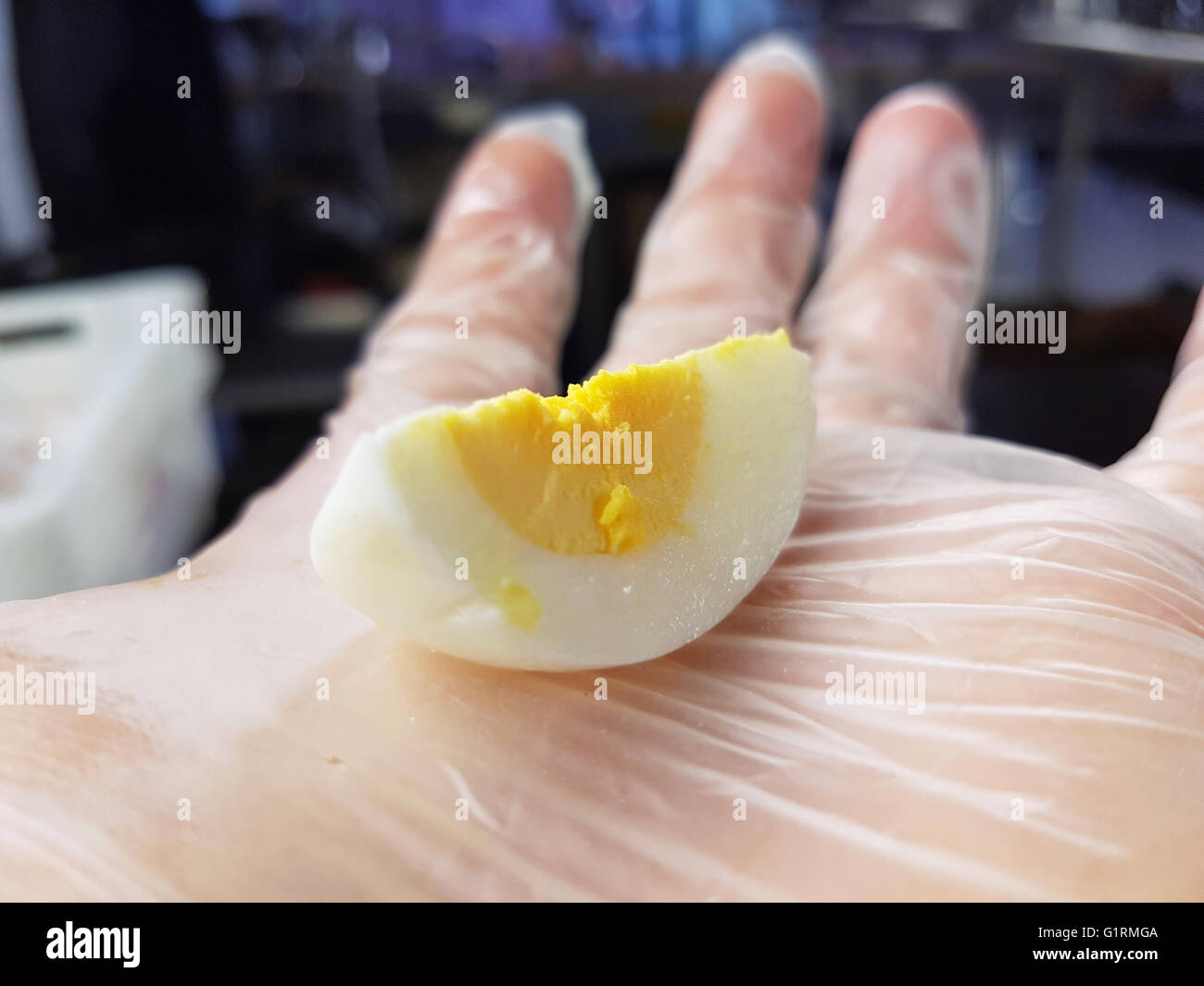 Boiled egg half of halves on a chefs hand Stock Photo Alamy
