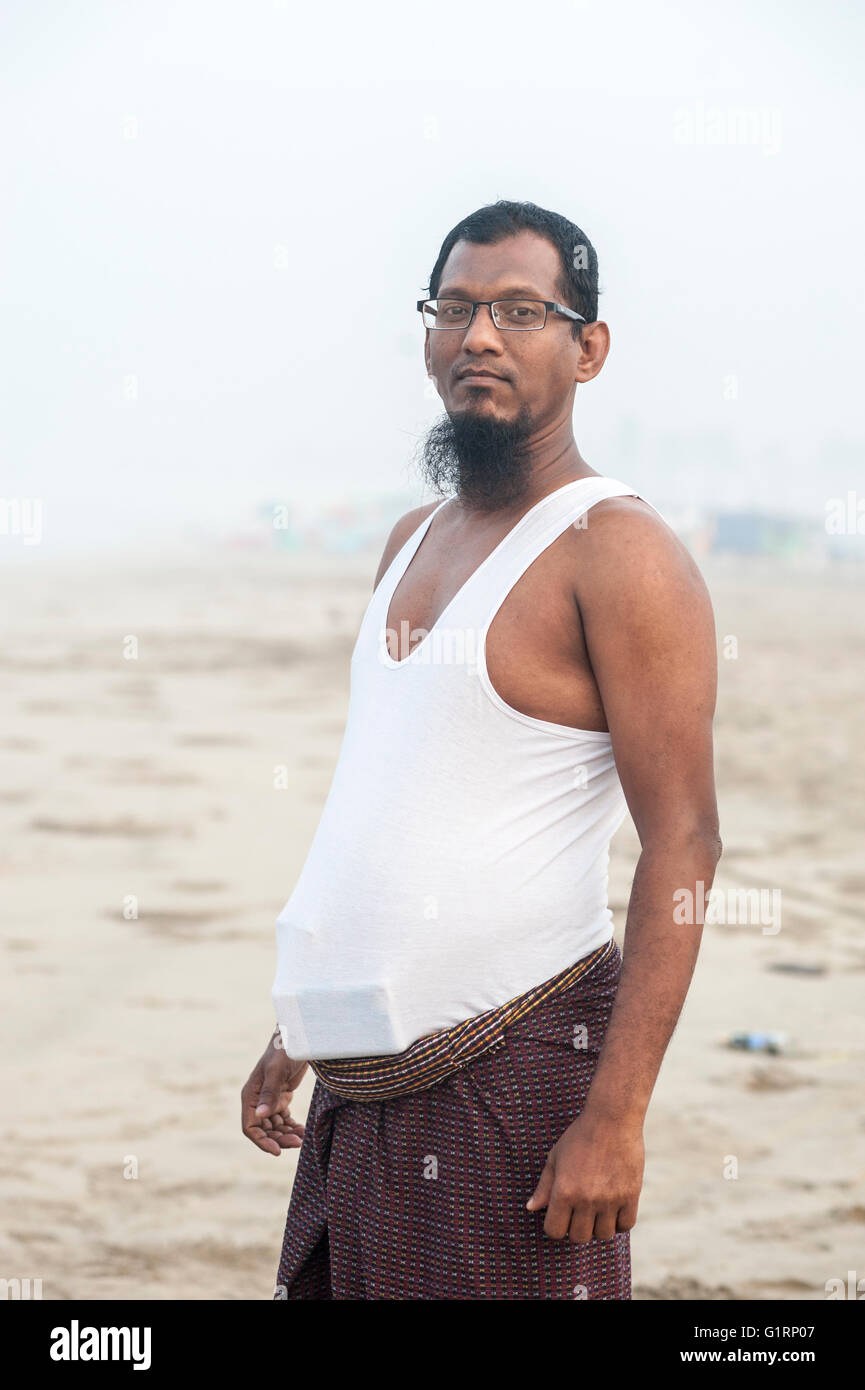 Portrait of a middle-aged Muslim Burmese man wearing glasses, short white  shirt and a beard Stock Photo - Alamy