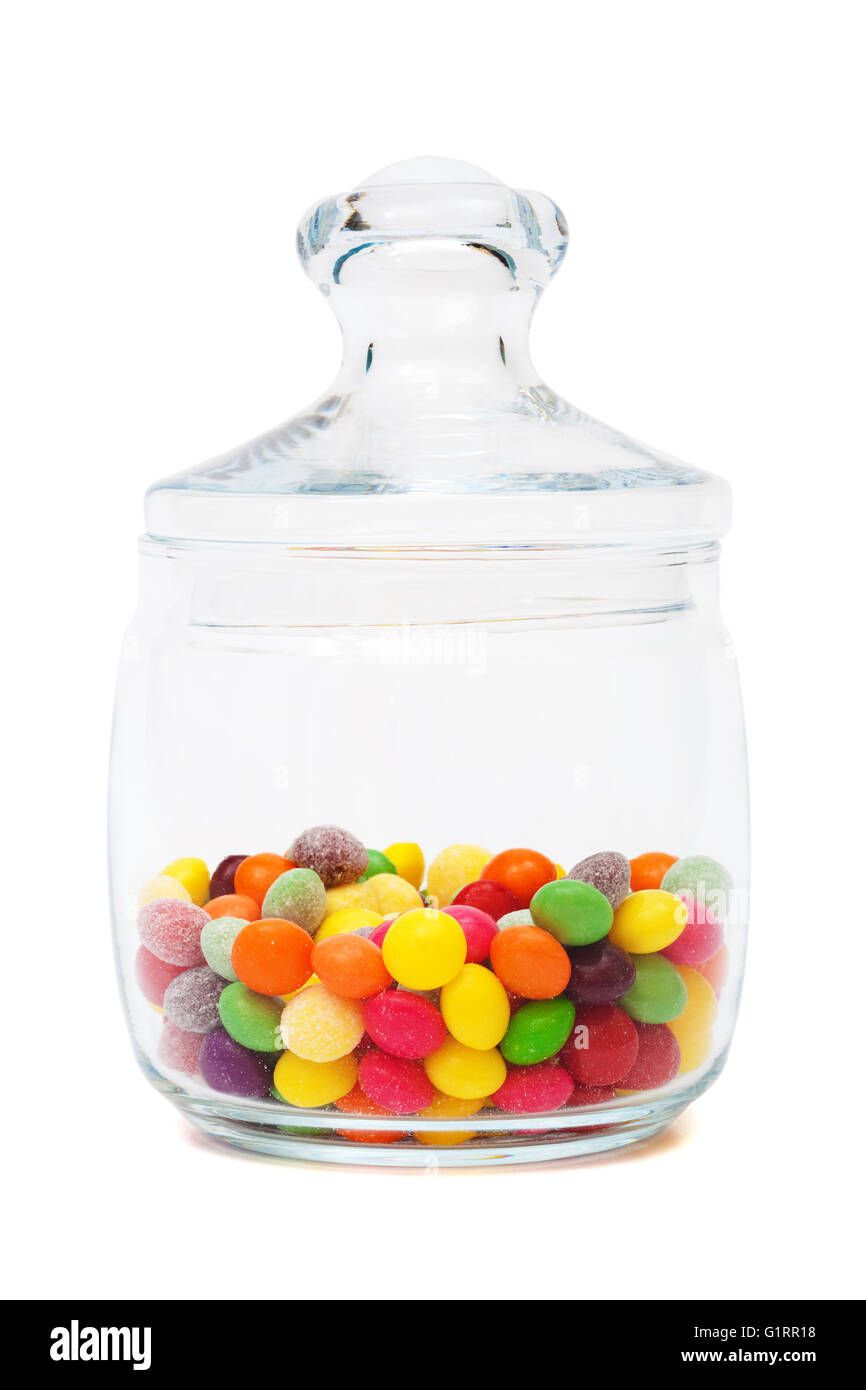 Candy in a glass jar on white background Stock Photo - Alamy