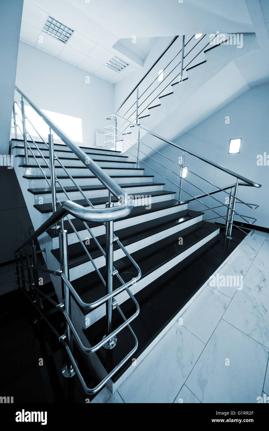 Marble staircase with a steel handrail in a modern building Stock Photo ...