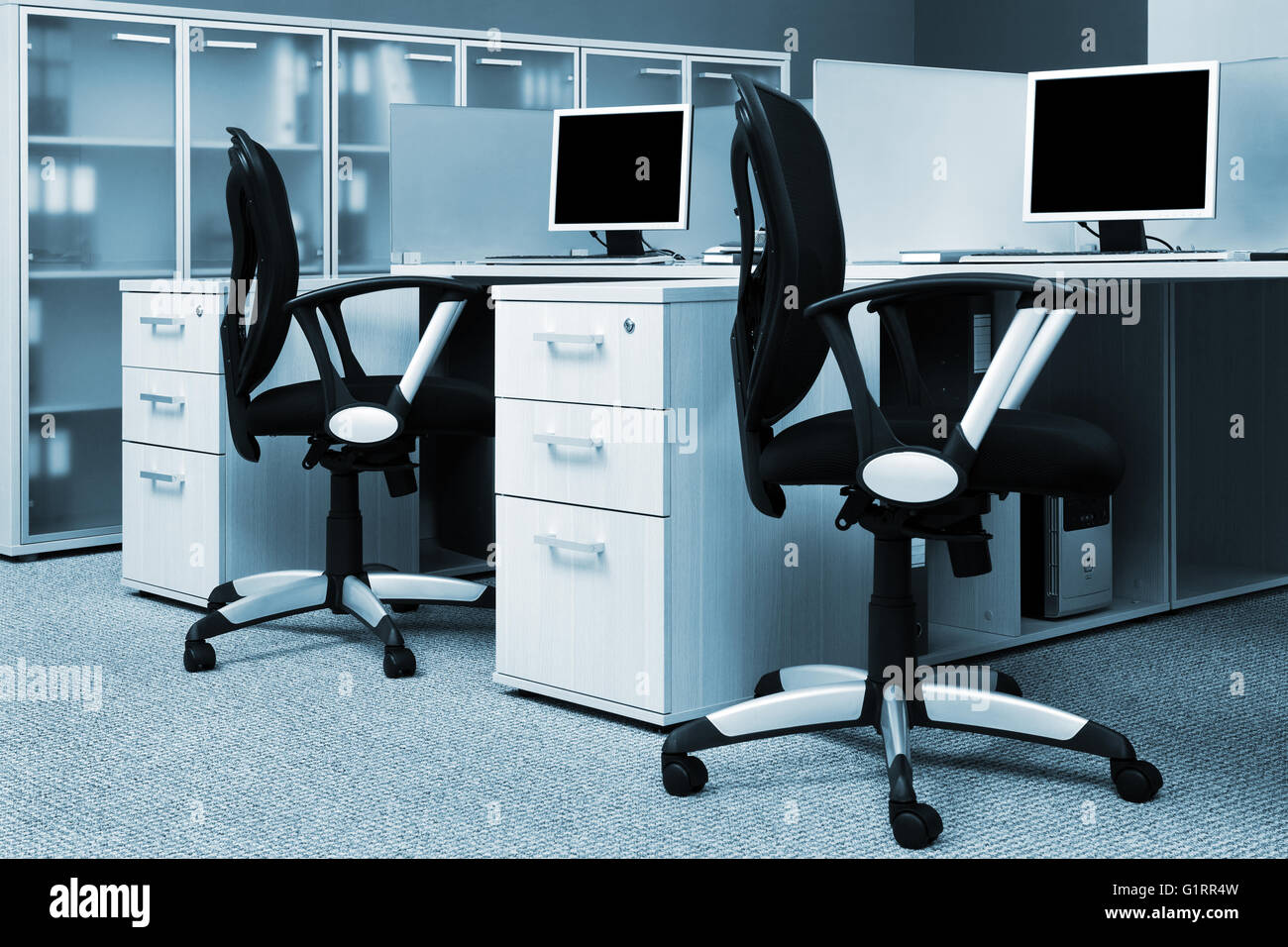 Computer Behind View computers behind the glass in a modern office Stock Photo - Alamy