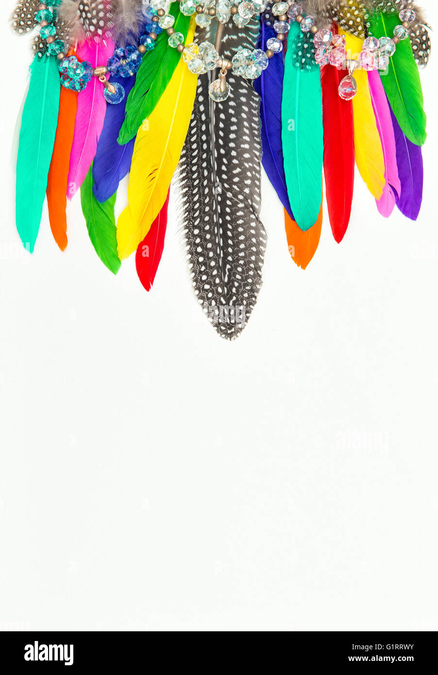 Decoration from feathers and gemstones. Boho style background Stock Photo