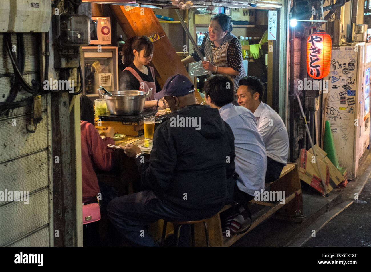People out eating in Tokyo, Japan Stock Photo