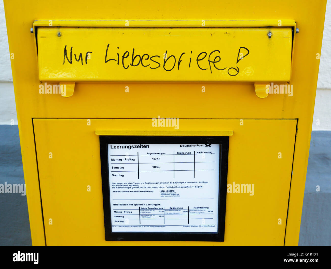 symbolism, humour, fun, love, yellow letterbox with the inscription 'love letters only', Federal Post Office, Germany Stock Photo