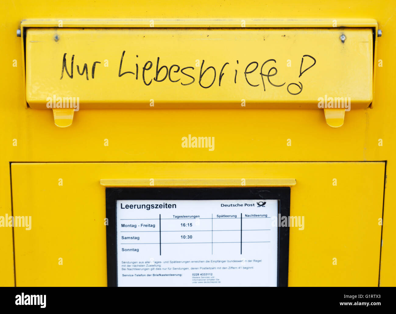symbolism, humour, fun, love, yellow letterbox with the inscription 'love letters only', Federal Post Office, Germany Stock Photo