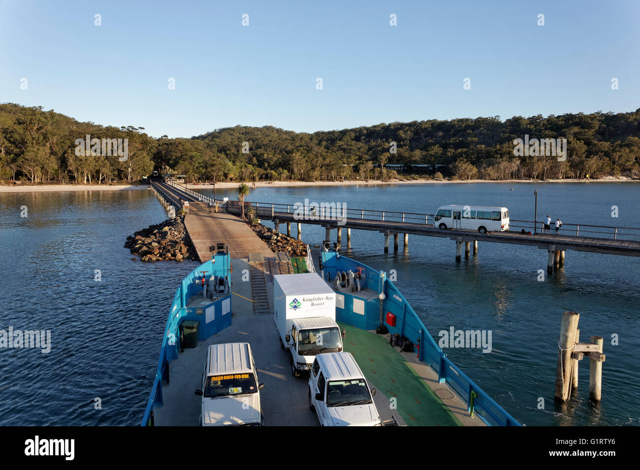 Kingfisher Bay ferry loaded with trucks and cars on the jetty of Stock