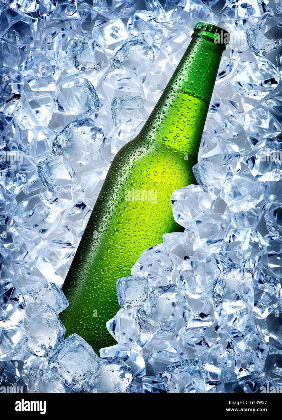 Green bottle in a cold blue ice Stock Photo