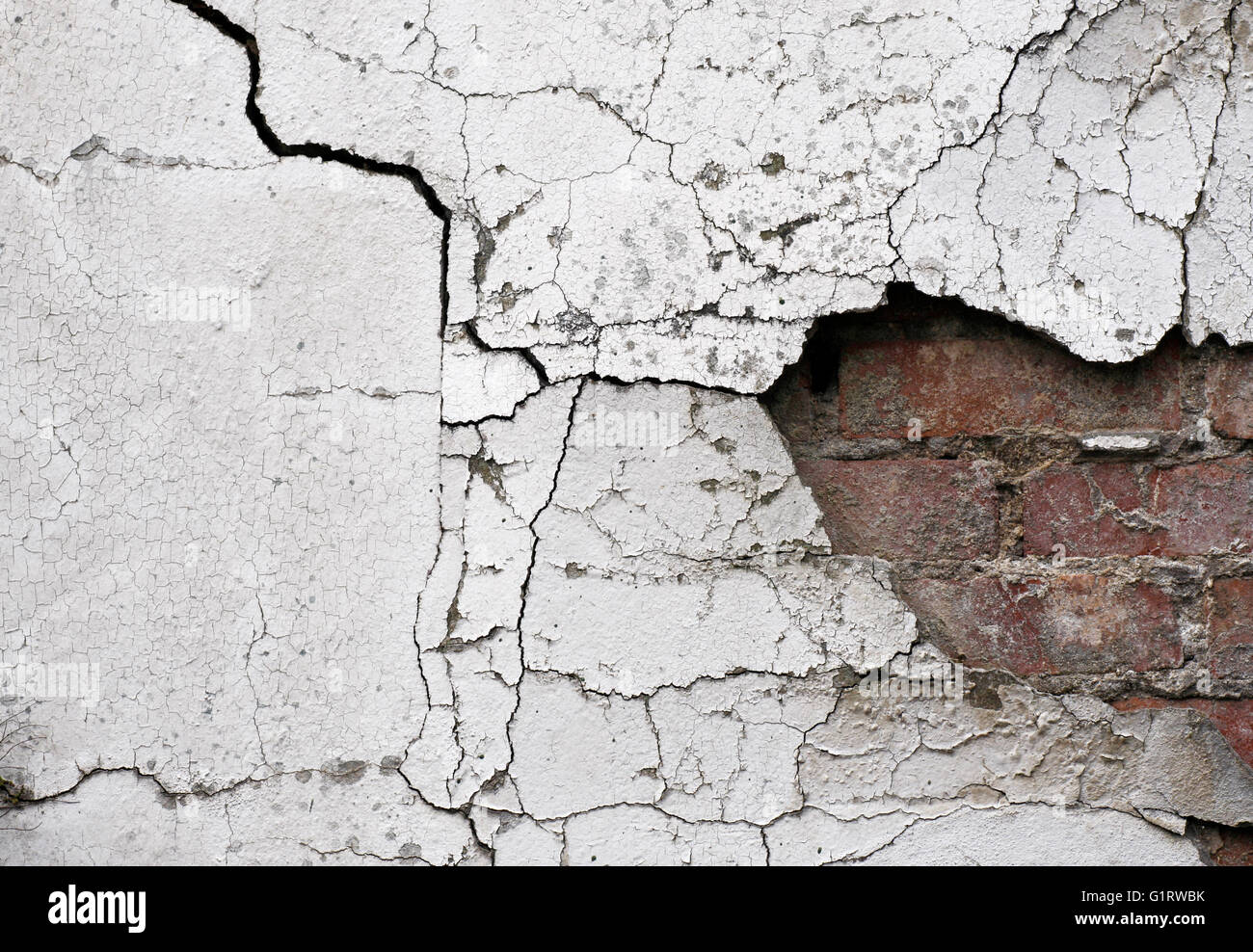 Old cracked wall background showing bricks underneath Stock Photo Alamy