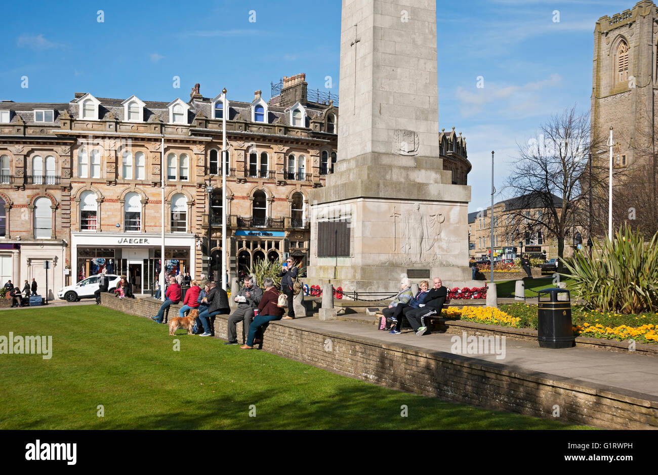 People visitors enjoying the spring sunshine in the town centre Cambridge Crescent Harrogate North Yorkshire England UK United Kingdom Great Britain Stock Photo