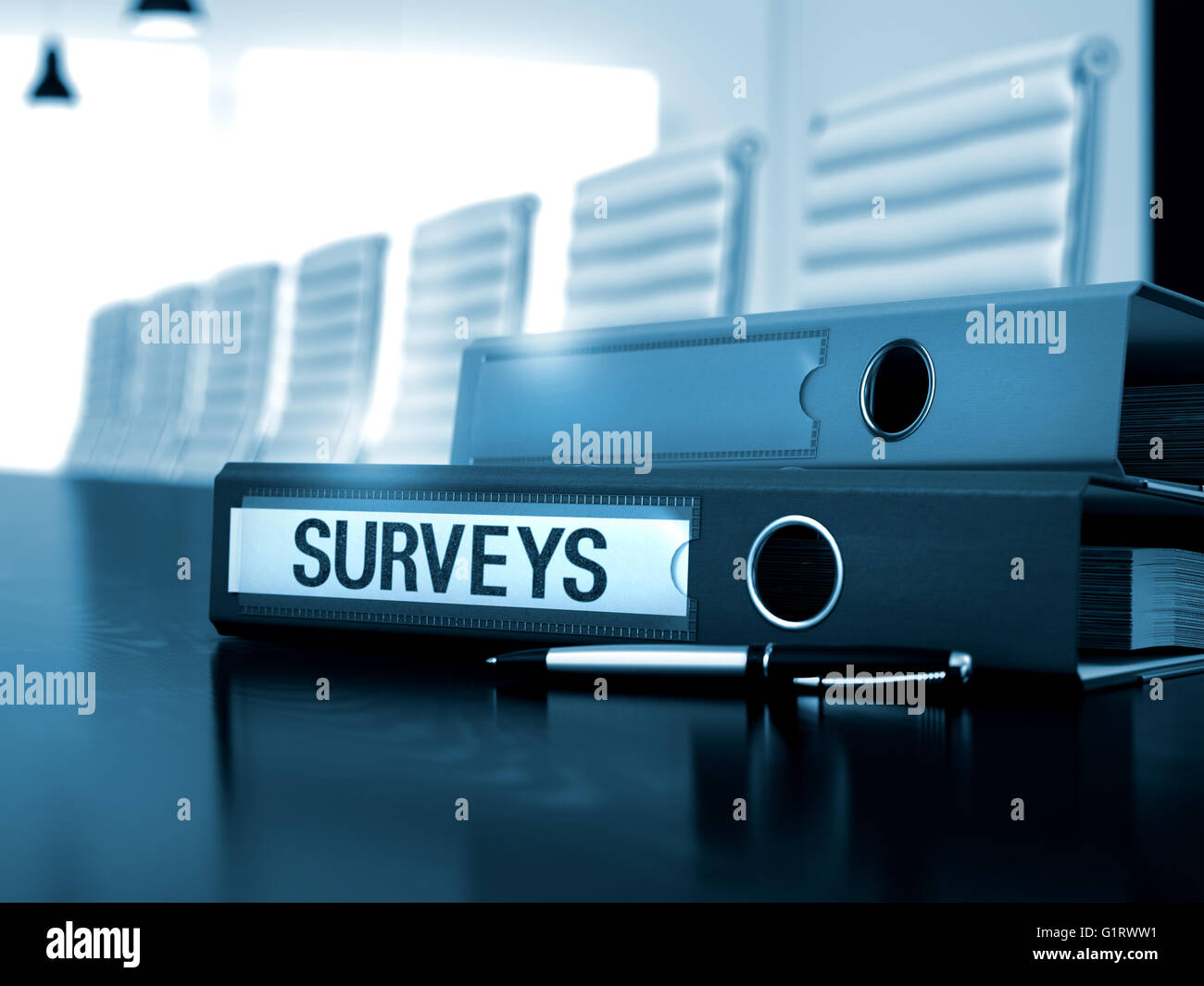 Surveys on Ring Binder. Blurred Image. Stock Photo