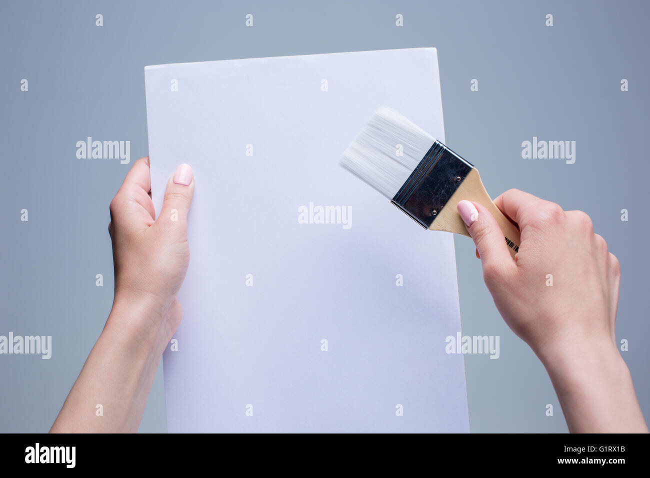 Hands holding brush hi-res stock photography and images - Alamy