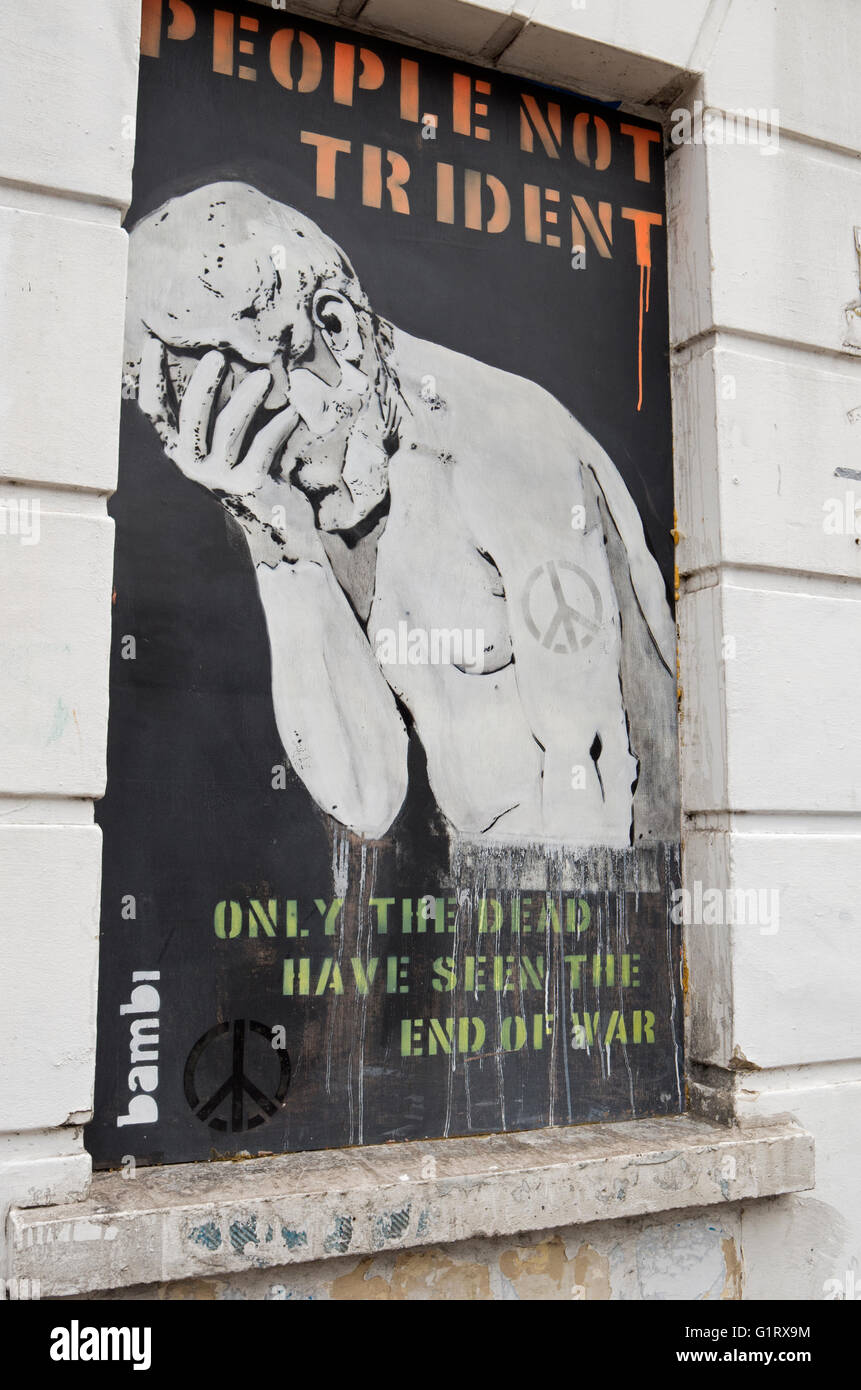 Anti-Trident street art graffiti in Camden Town, London. Stock Photo