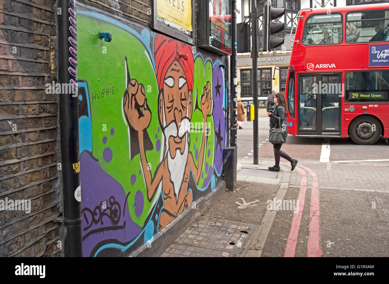 Street art of a meditating guru in Camden Town, London. Stock Photo