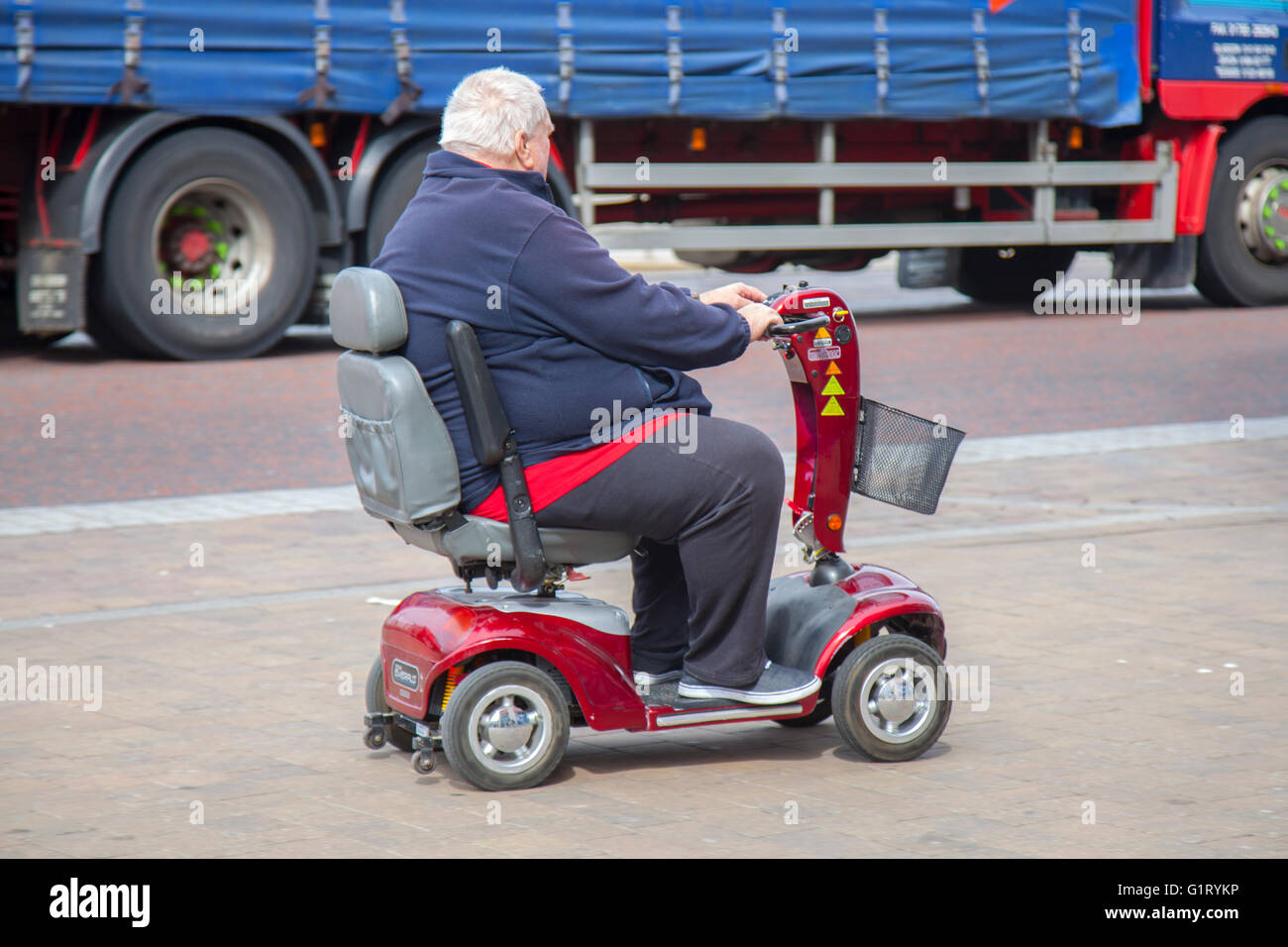 Obese man mobility scooter hi-res stock photography and Alamy