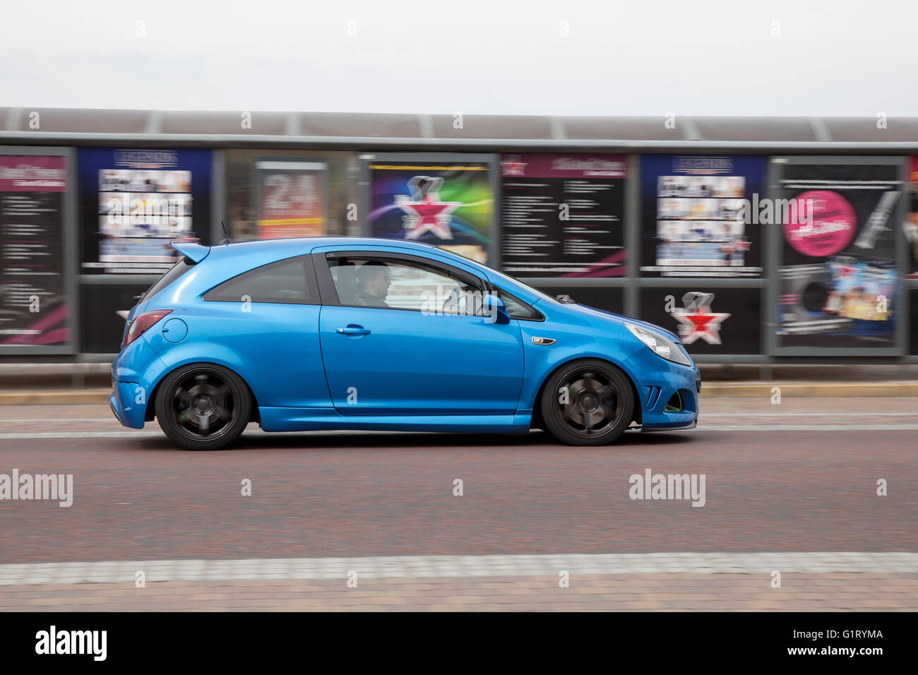 Audi vehicle in motion being driven along the seafront at Blackpool