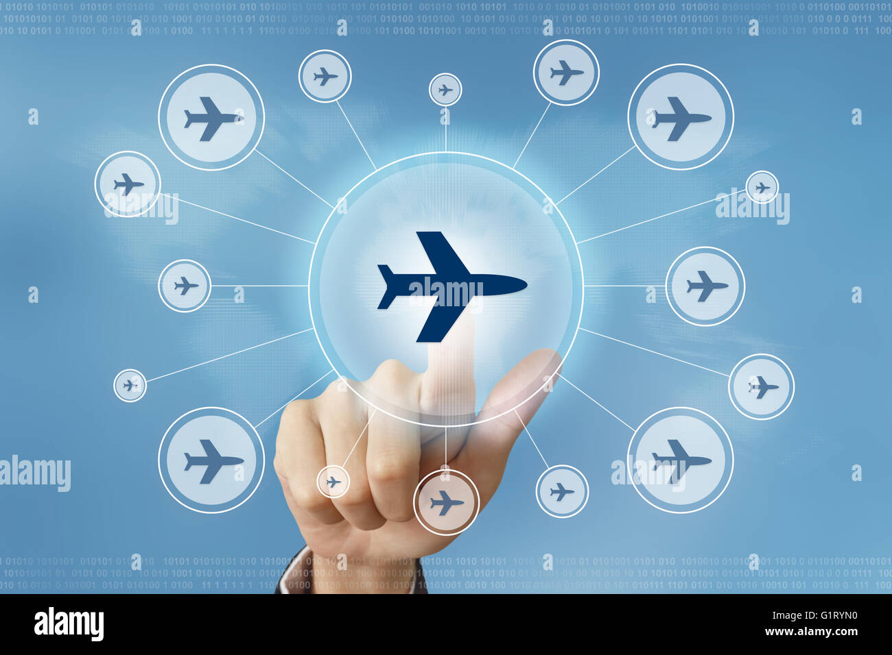 business hand pushing flight trip button with global networking concept Stock Photo