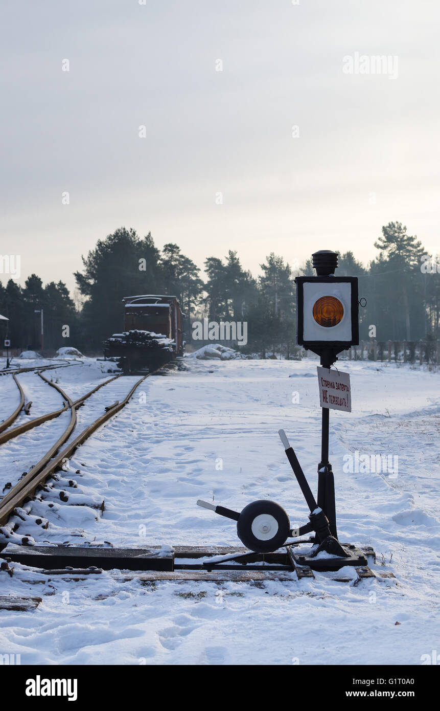 Traditional railway old iron switch with orange lamp in Russian railway museum in winter Stock Photo