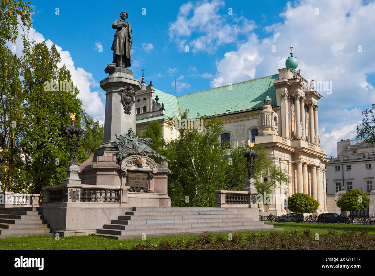 The Adam Mickiewicz Monument and the Carmelite Church on Krakowskie Przedmiescie street in Warsaw, Poland Stock Photo