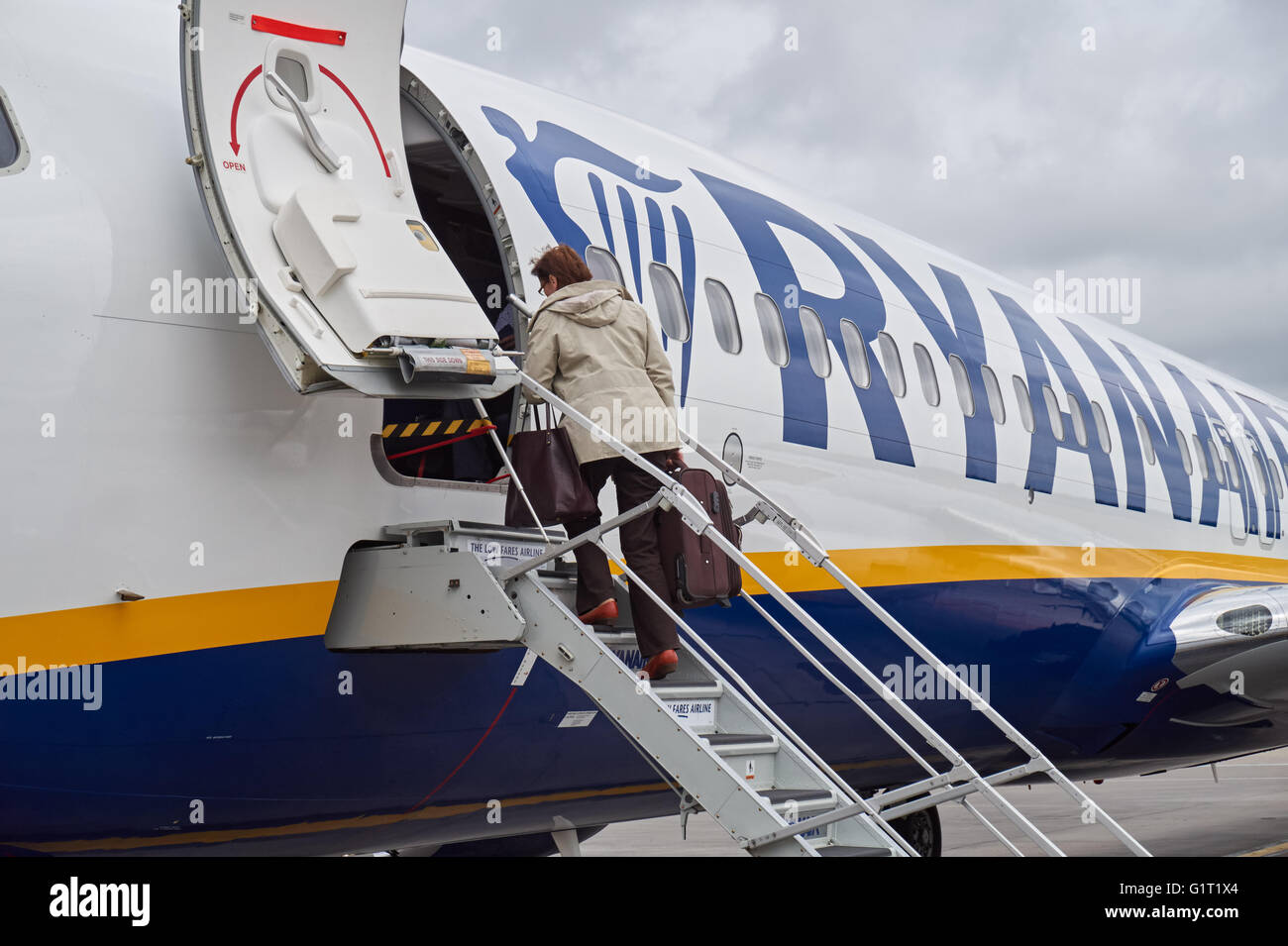 Passenger boarding Ryanair plane at London Stansted Airport, England United Kingdom UK Stock Photo