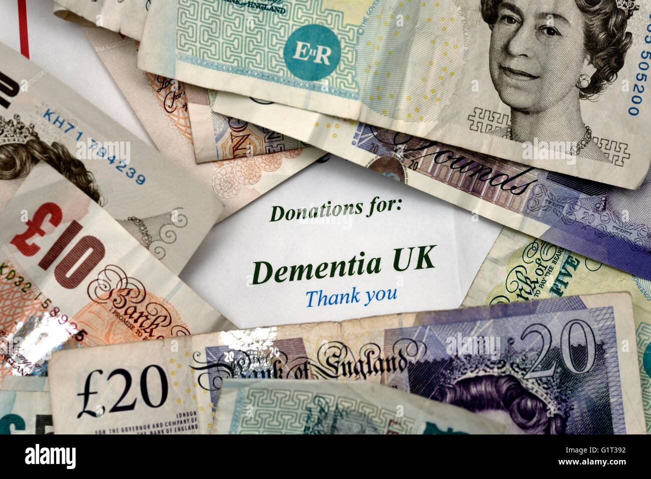 Cash money charity donation for dementia UK Stock Photo Alamy