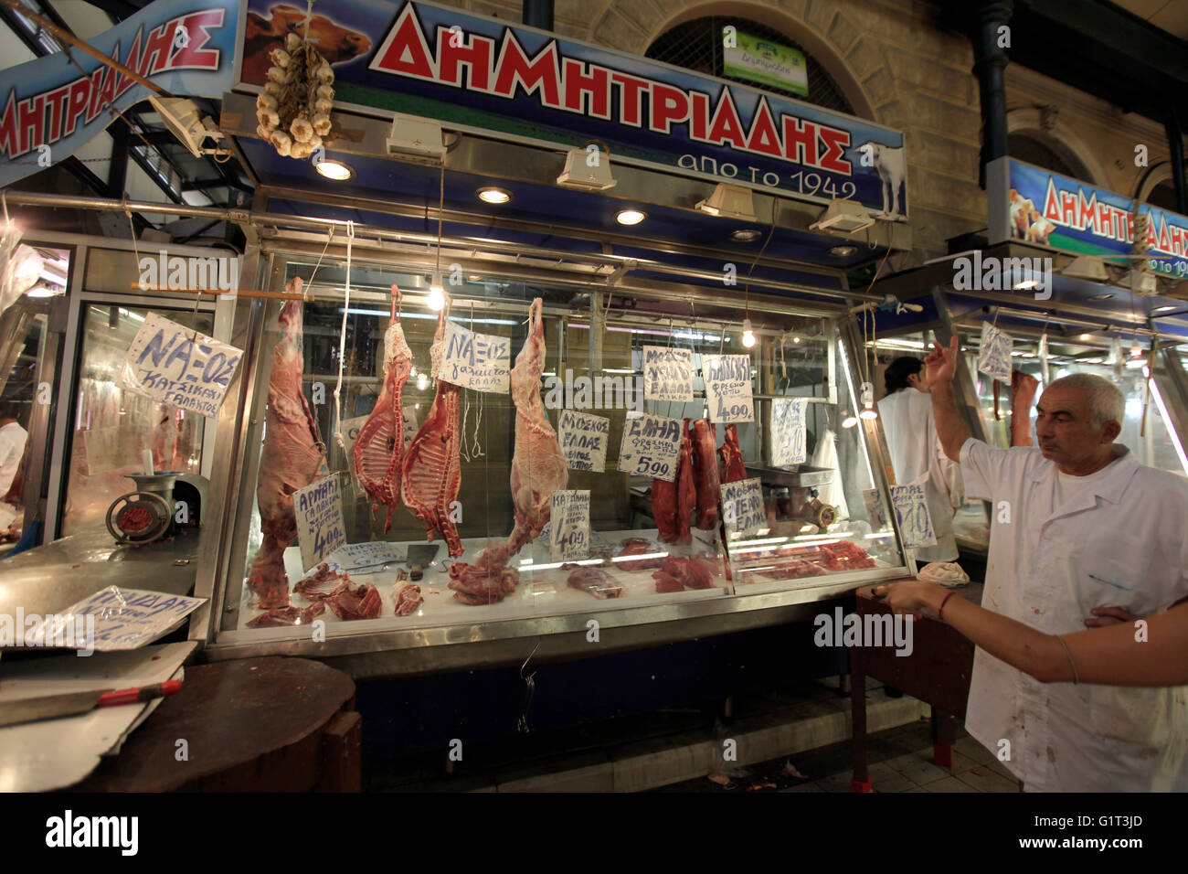 a meat seller/ vendor inside the central market or Athens Dimotiki