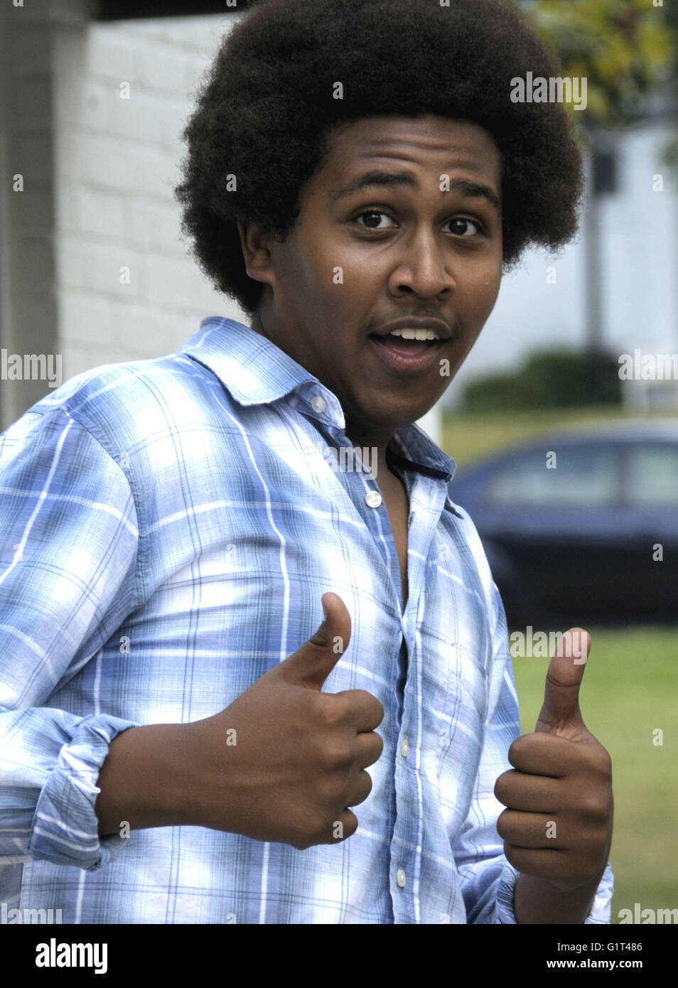 Teenager thumbs up african hi-res stock photography and images - Alamy
