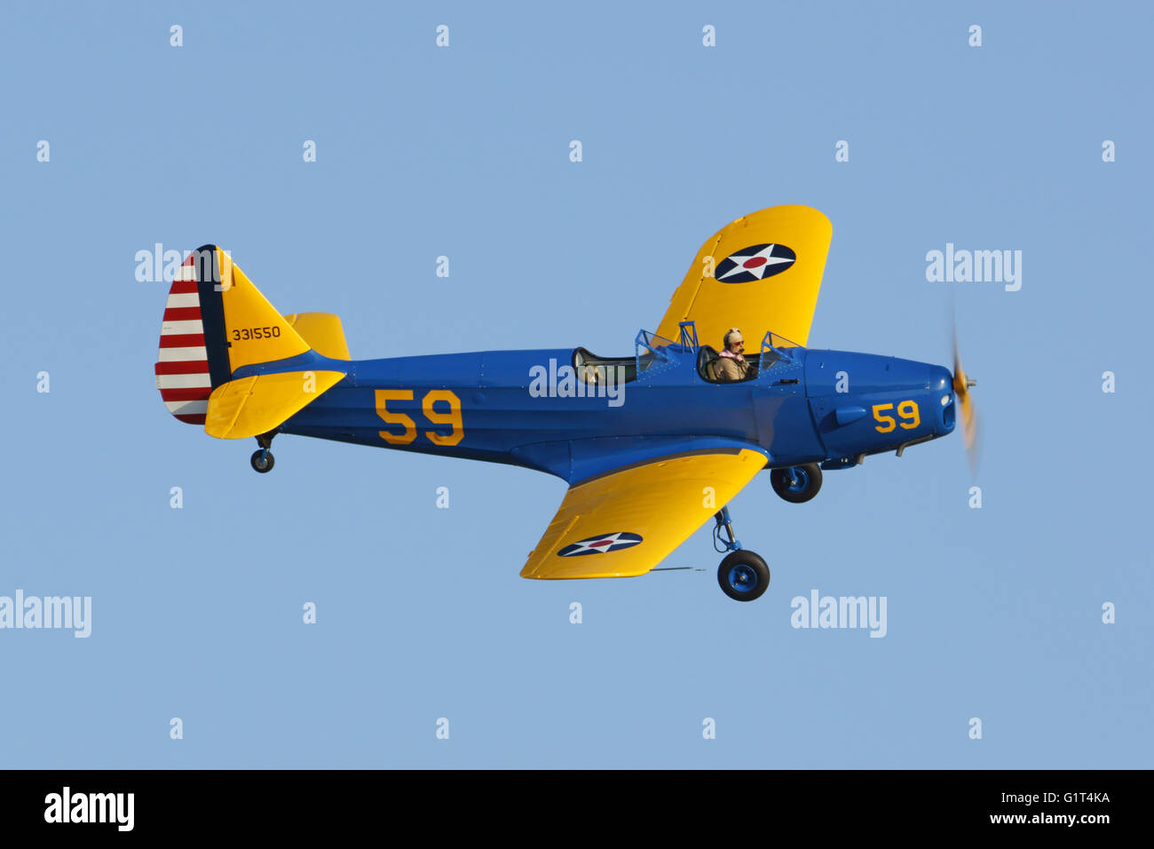 Airplane vintage WWII Army two seat trainer propeller aircraft flying