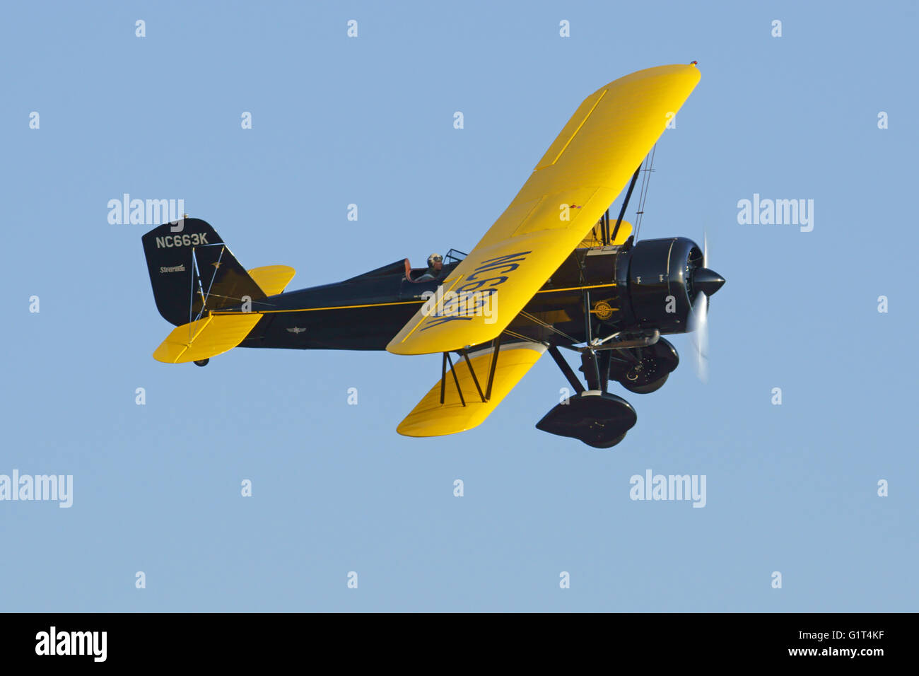 Airplane vintage WWII biplane propeller aircraft flying at 2016 Planes