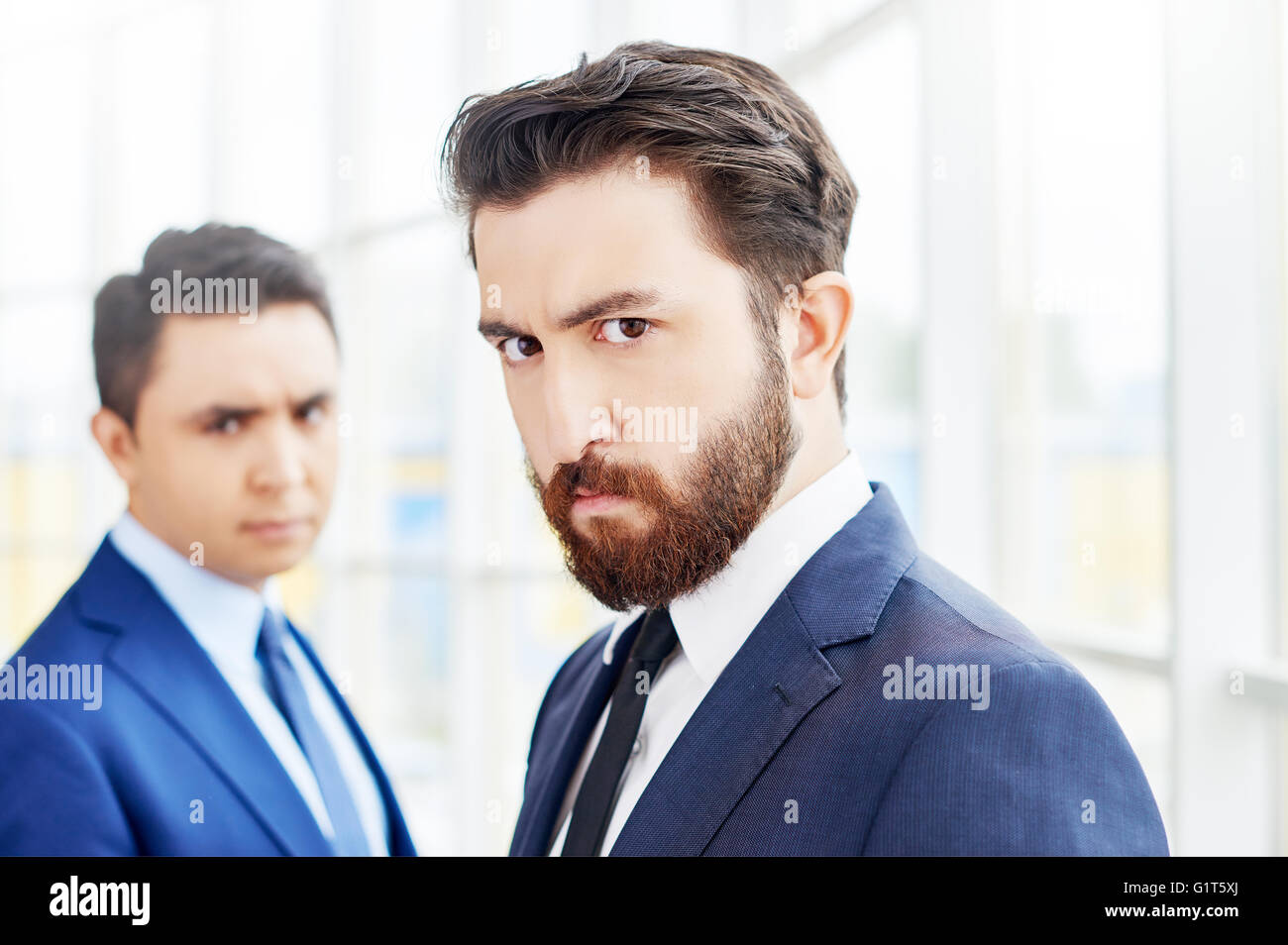 Portrait of sullen businessmen Stock Photo