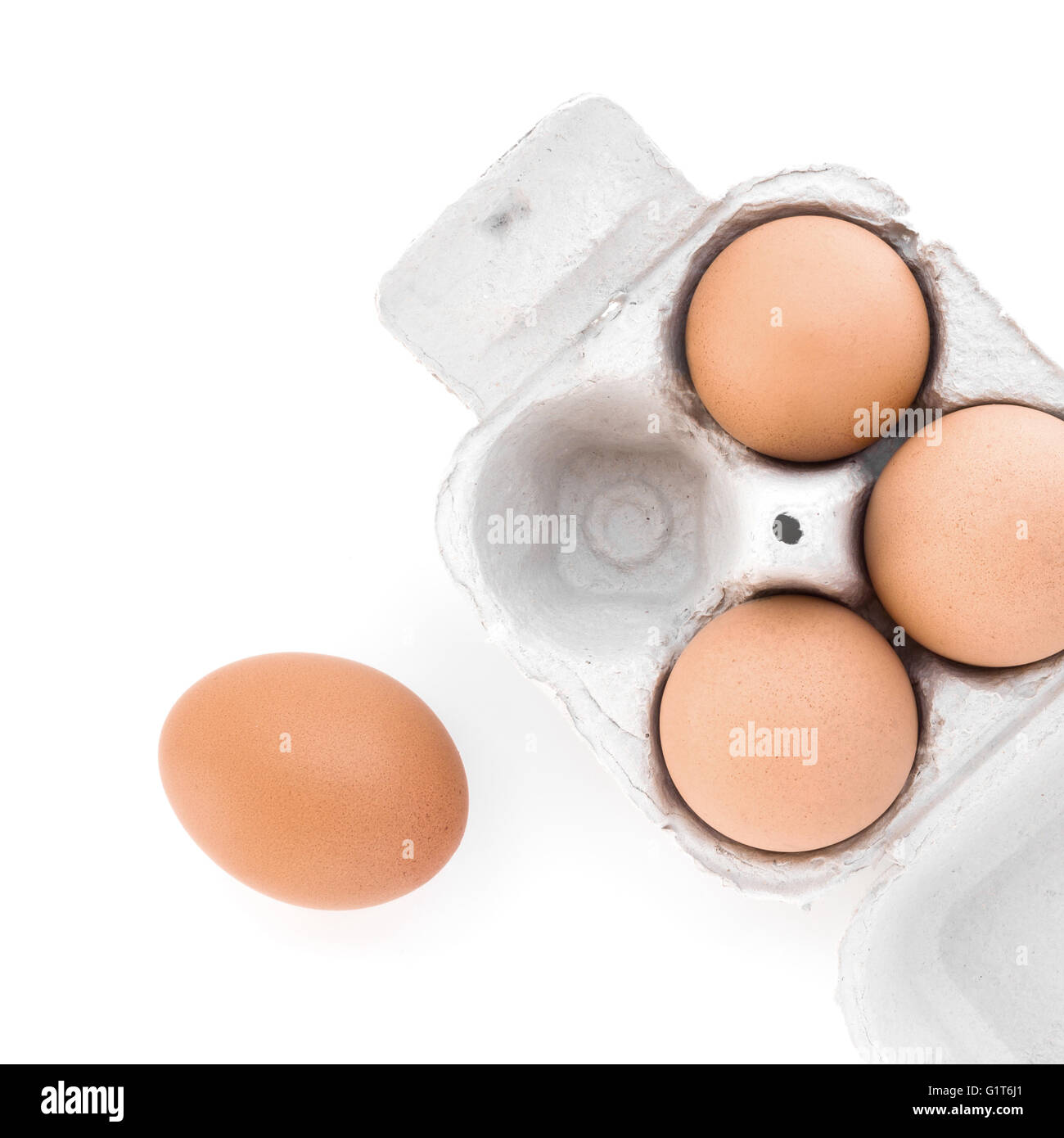 Brown eggs in carton with white background Stock Photo