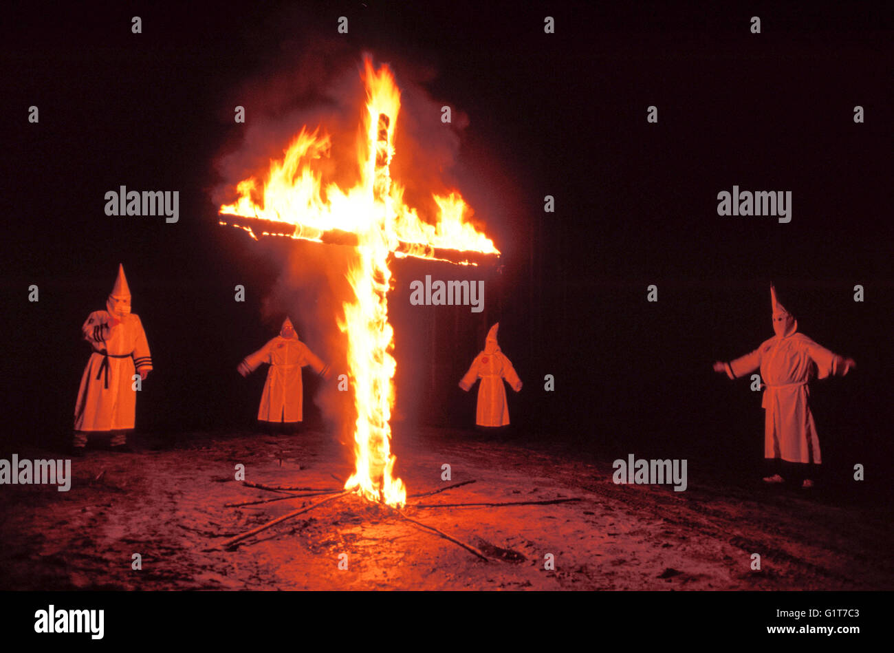 Ku Klux Klan round a fiery cross in South Florida Stock Photo