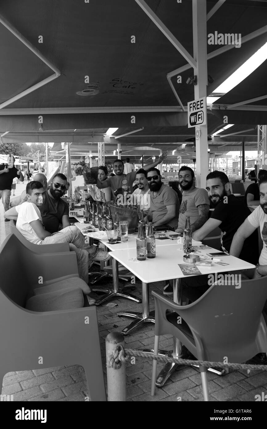 A group of friends celebrating with lots of beer Stock Photo