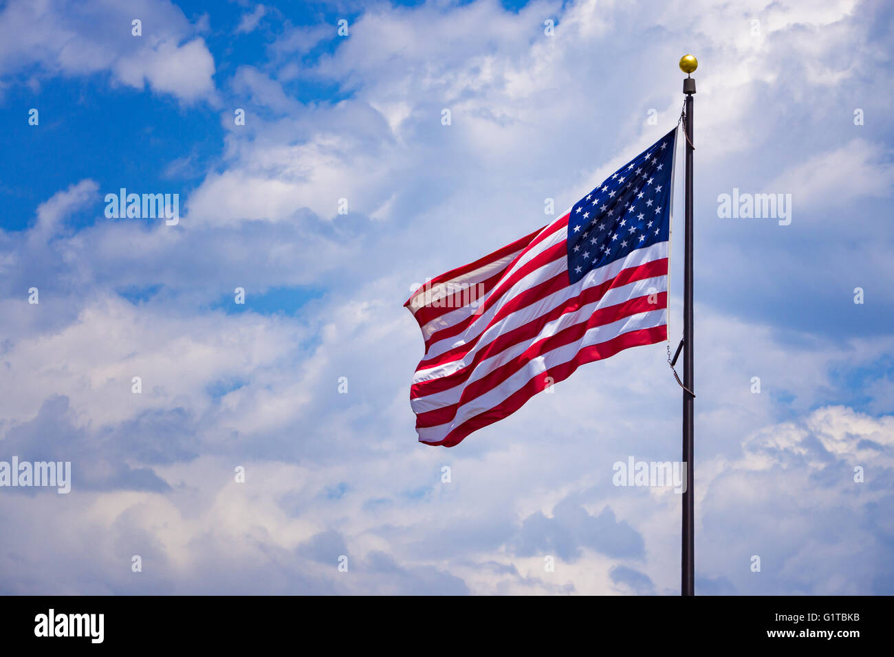 American USA Uniter States flag waving with a cloud background Stock ...