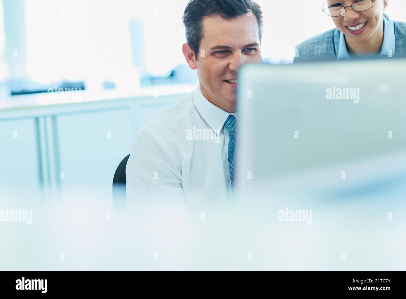 Business people working at computer in office Stock Photo