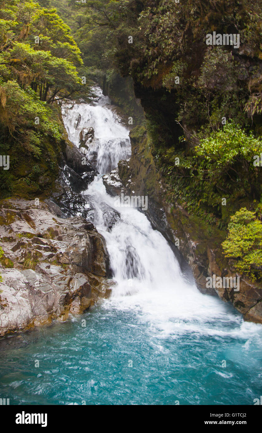 Waterfalls flowing down mountains in New Zealand Stock Photo - Alamy