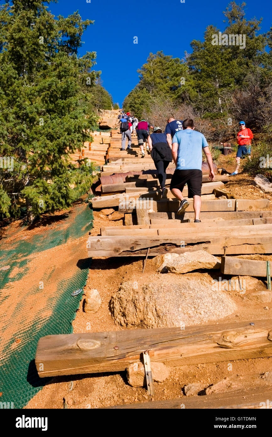 Hikers climbing the Manitou Incline and descending via the Barr Trail on Pikes Peak Colorado on a beautiful spring morning Stock Photo