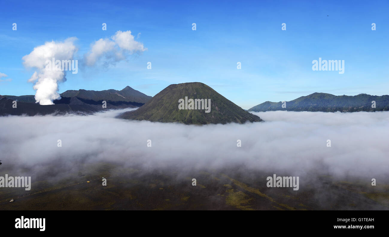 Sunrise over the smoking Gunung Bromo volcano, Bromo-Tengger-Semeru National Park, Java, Indonesia. Stock Photo