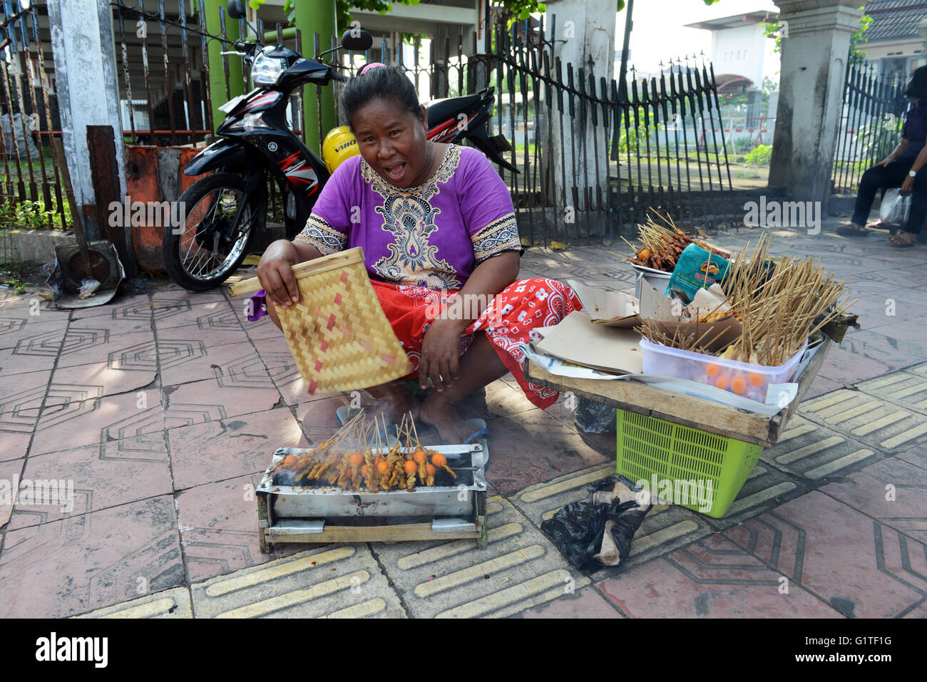 Chicken Satay ( ayam sate ) is a signature street food dish in Indonesia. Stock Photo