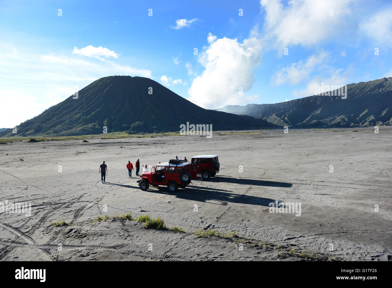 Tourist exploring the 'Sea of Sand' at the Bromo-Tengger-Semeru National Park in eastern Java. Stock Photo