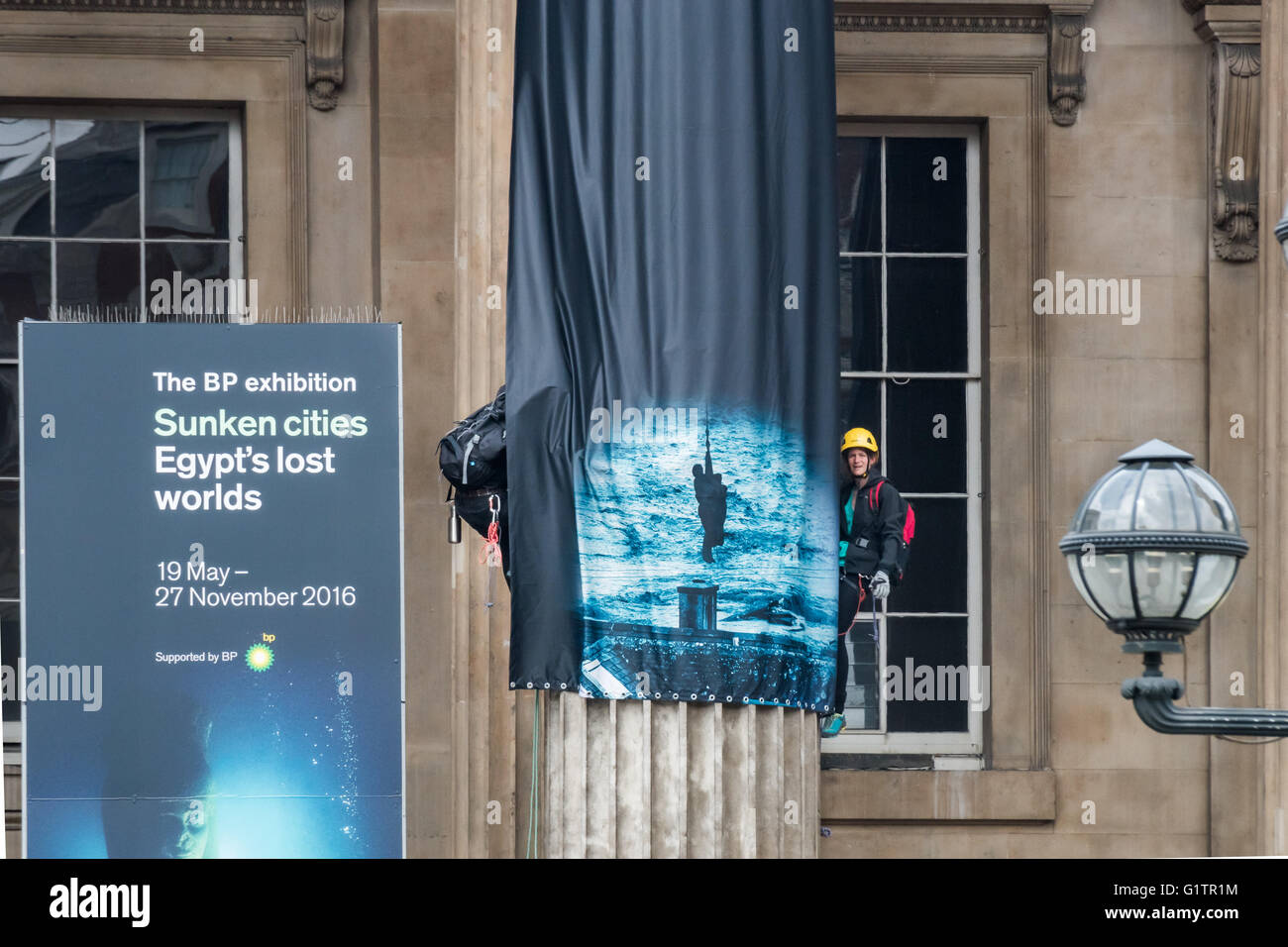 London, UK. 19th May, 2016. Greenpeace activists at the British Museum climbing on its columns where they have hung 7 giant banners on the opening day of the BP-sponsored 'Sunken Cities' exhibition, pointing out BP's responsibility for global warming, promoting the sale of oil leading to unstable weather and sea level rise which is now flooding cities and communities around the world. The banners named and showed images of flooding in the UK and worldwide and renamed the show 'Sinking Cities' to reflect BP's activities. Peter Marshall/Alamy Live News Stock Photo