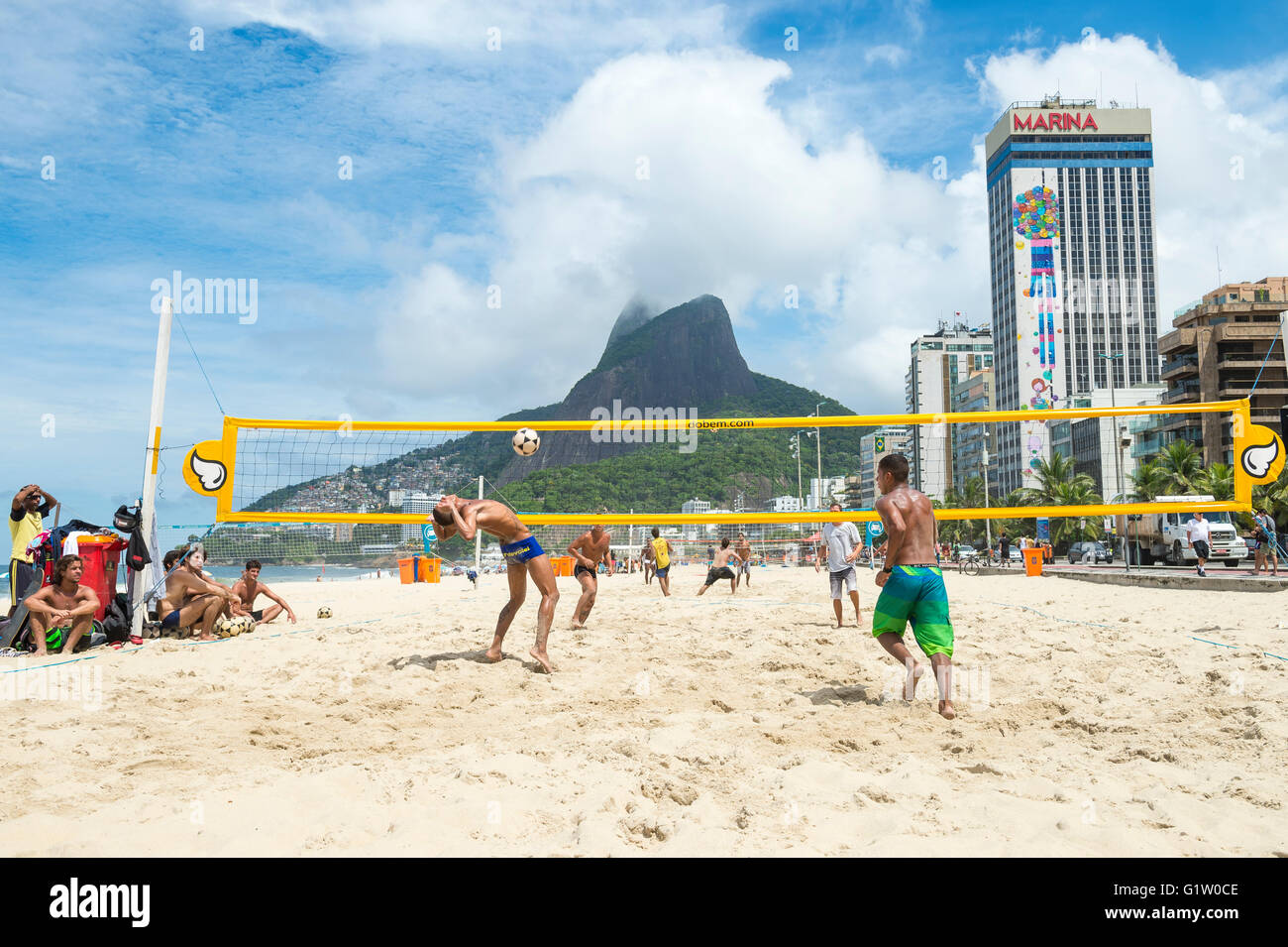 RIO DE JANEIRO - MARCH 17, 2016: Young Brazilians play a game of futevolei/footvolley, a sport combining football and volleyball Stock Photo
