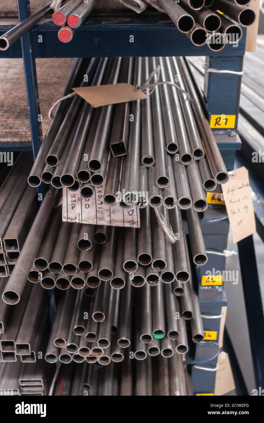 Stocks of steel tubing on inventory shelves and racks Stock Photo - Alamy